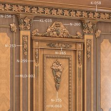 Carved applique N-265 and other elements from the "Grape" collection on walls in interior
