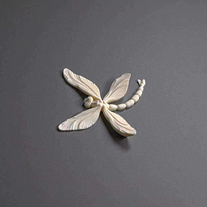 Cabinet with elegant decorative elements of molding NPU-480 in golden color, furniture decor in a modern style.