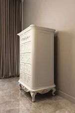 Curved legs for a chest of drawers made of wood