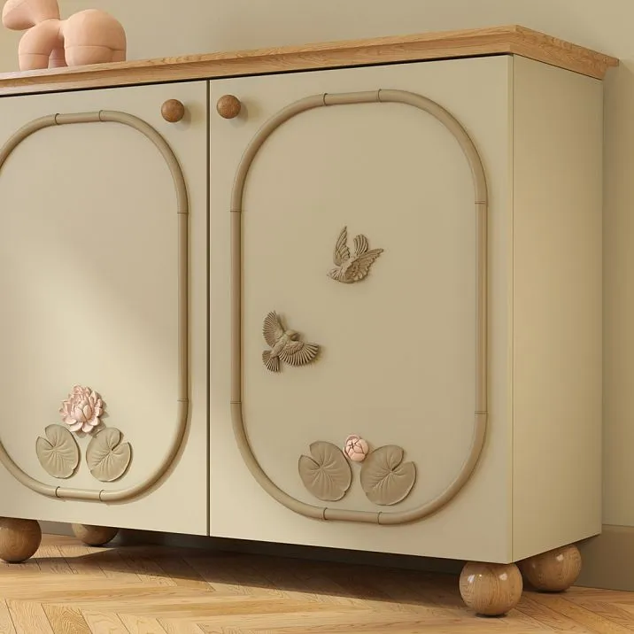 Relief decoration NPU-492L in the form of a bird, mounted on the facade of a furniture item,