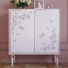 Cosmetic table with mirror, decorated with NPU-481 molded ornament in the form of golden butterflies on the wall.