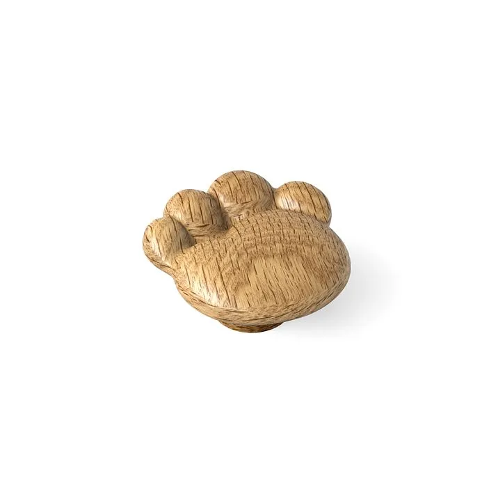 Wooden furniture handle in the shape of a paw on a white background