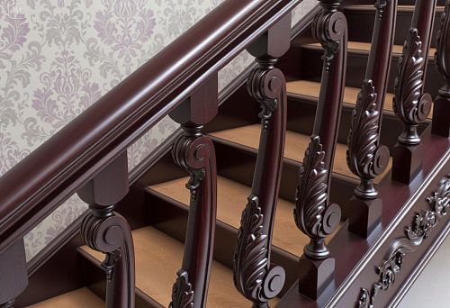 Крупный план крепления резных балясин к лестнице и перилам