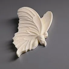 Living room interior decorated with stucco NPU-482L in butterfly shape on walls and furniture