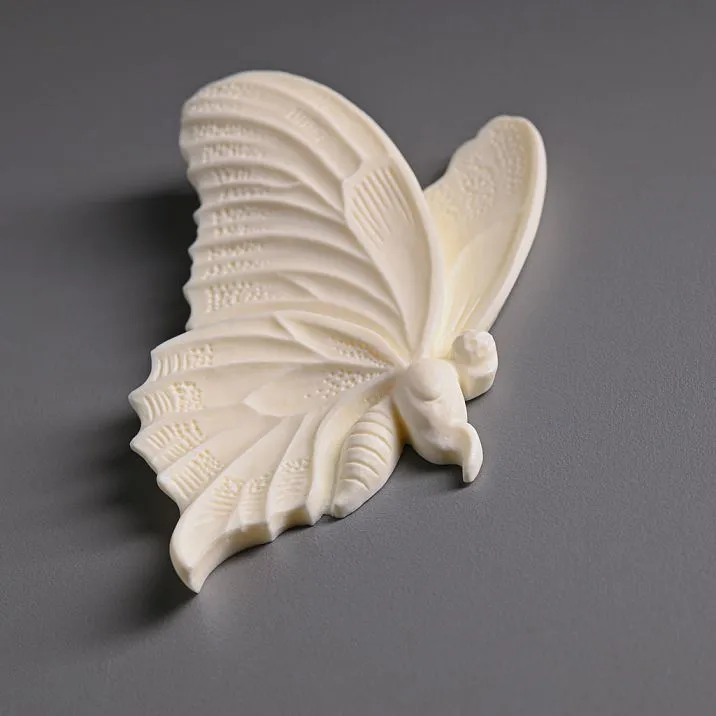 Living room interior decorated with stucco NPU-482L in butterfly shape on walls and furniture