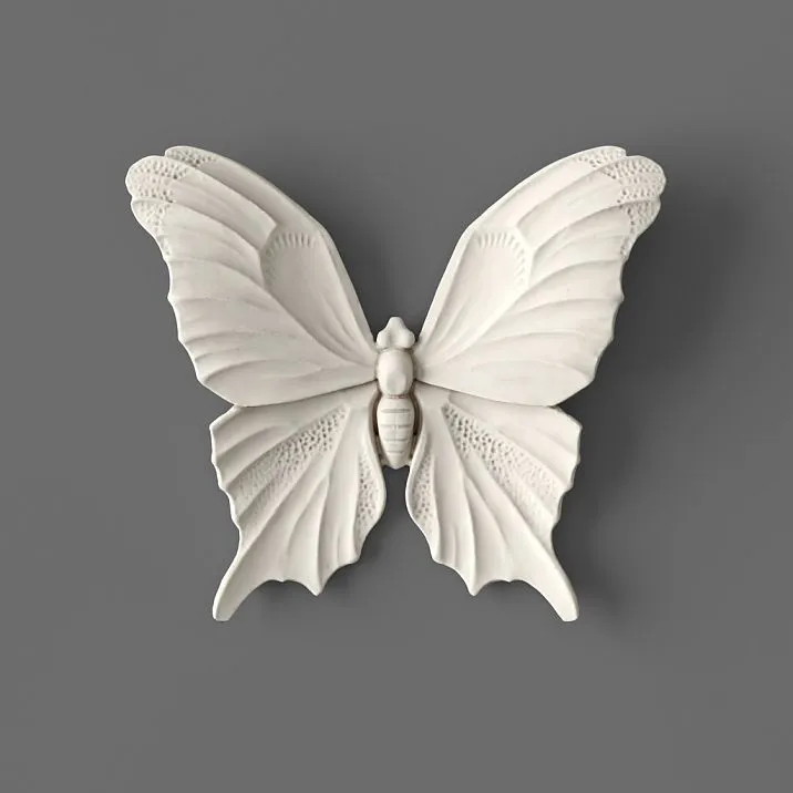 Molded decor NPU-479 from polyurethane in the form of a white butterfly, close-up