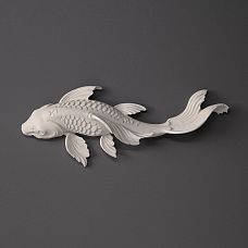 Wall panel with backlighting and decorative polyurethane fish with gold finish in a modern interior.