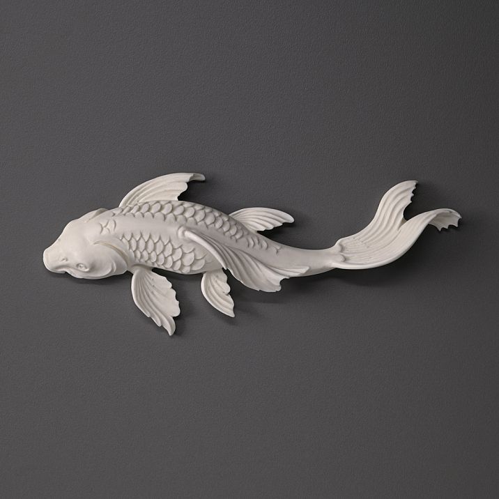 Wall panel with backlighting and decorative polyurethane fish with gold finish in a modern interior.