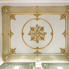 Carved Molding End Cap N-364R on wooden surface