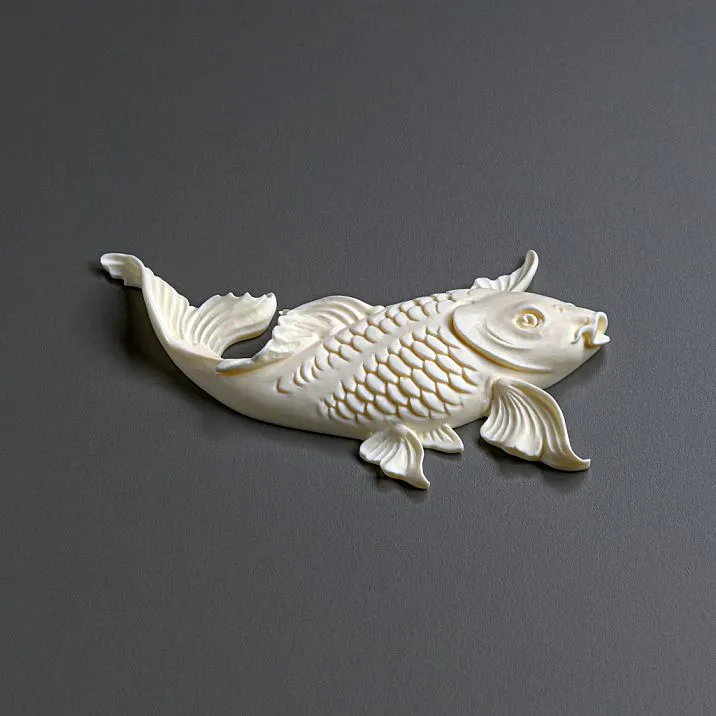 Elegant interior with a blue chest of drawers decorated with fish and plant motifs stucco.