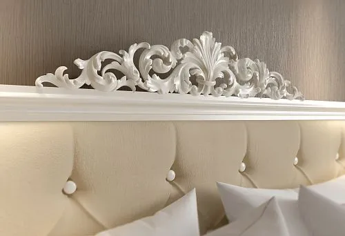 Classic wooden bed with hand-carved detailing