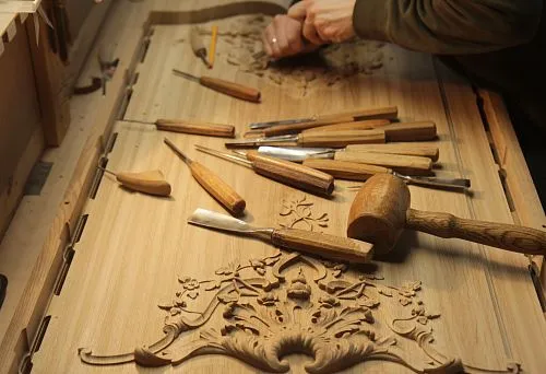 Wood carving process &ndash; craftsman at work