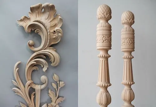 Detailed carved wooden decorative element with smooth leaf-like scrolls and floral motifs
