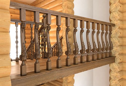 Decorative wooden balustrade in the interior of a wooden house.