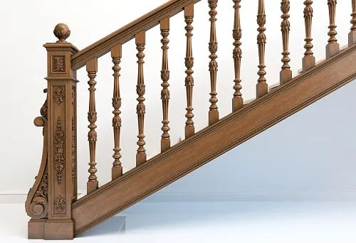 Elegant wooden staircase with carved balusters, decorative posts, and refined handrails