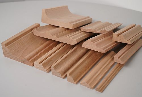 Set of wooden planks and moldings of various shapes and profiles