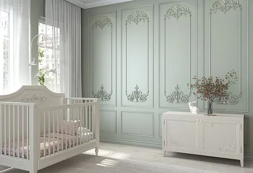 Children's room interior with carved wooden bed and dresser made of solid wood against a wall with classic decor