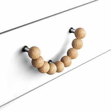 Furniture half-ring handle Eclipse HL-072.1 made of natural wood on a white facade, angled view