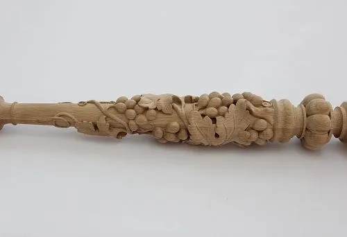 Decorative lathe baluster from natural wood with artistic carving
