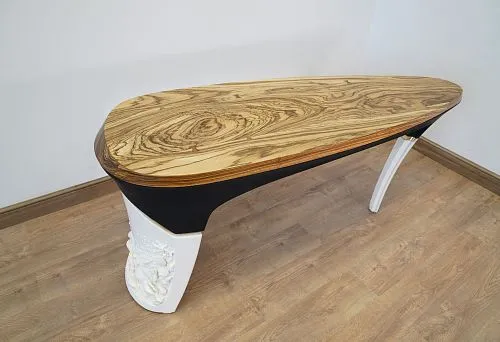 Classic wooden table with carved legs and polished top, crafted in traditional style