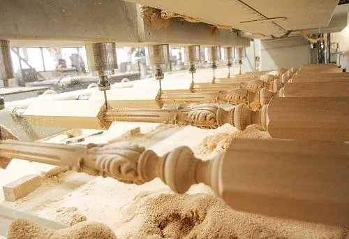 The process of milling carved balusters at the factory &mdash; creating decorative stair railings