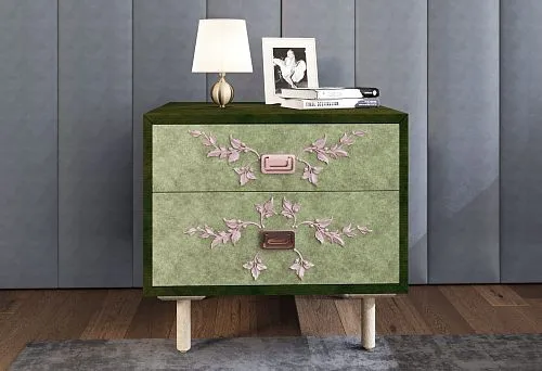 Designer bedside table with green fronts and pink carved branch-like elements