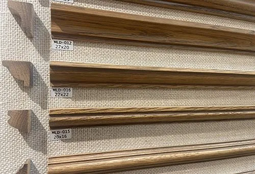 Collection of decorative moldings in various profiles and sizes, presented at the stand