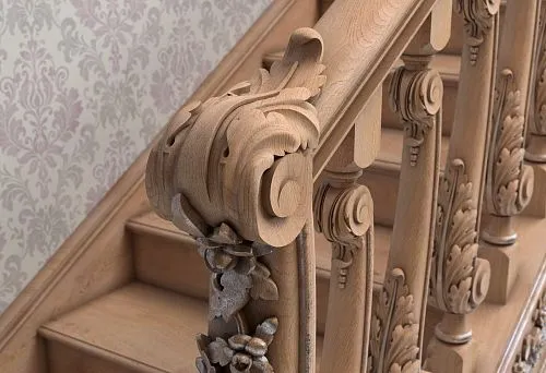 Carved wooden handrail with baluster mounting and floral decoration