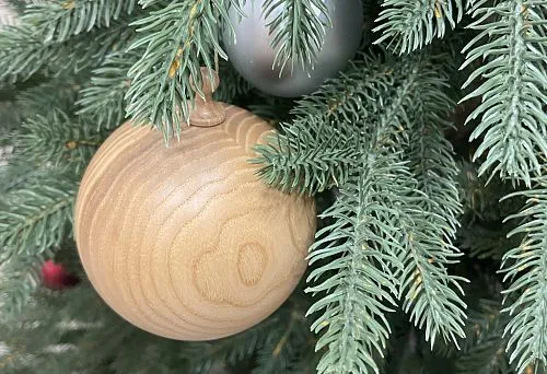 Close-up of handcrafted wooden Christmas ball