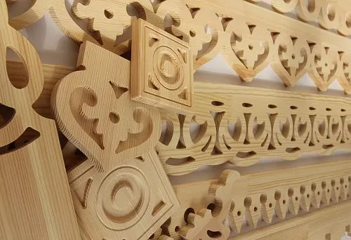 Decorative wooden casings with classic carving elements.