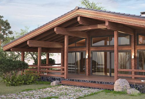 House in the style of a Russian estate with decorative elements and carvings on the facade.