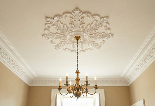 Polyurethane ceiling molding with a chandelier rosette and classic ceiling cornice
