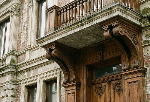 Premium facade: polyurethane facade stucco with cement coating and carved wooden portal