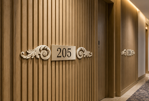 Pair of carved overlays NPU-247L/R 153 &times; 65 mm around the room number plate