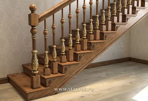 Wooden balusters with gold elements in a classic interior