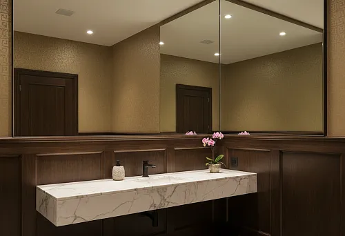 Guest bathroom with high dark wood skirting panel and floor-to-ceiling mirror above a marble console sink