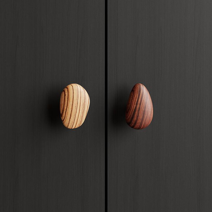 Pebble HL-065-3M furniture handle in walnut with gray oil, shaped like a smooth pebble for modern kitchens and cabinets