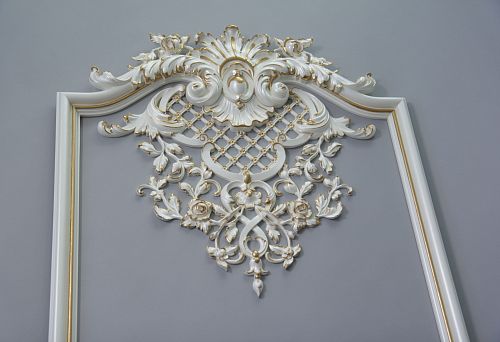 Decorative composition for wall with carved elements and moldings