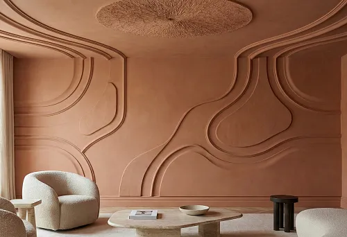 A Warm Living Room with Polyurethane Molding: Large Moldings Form Smooth Relief Lines on the Walls, Monochromatic Terracotta Finishes, and Soft Modern Furniture.