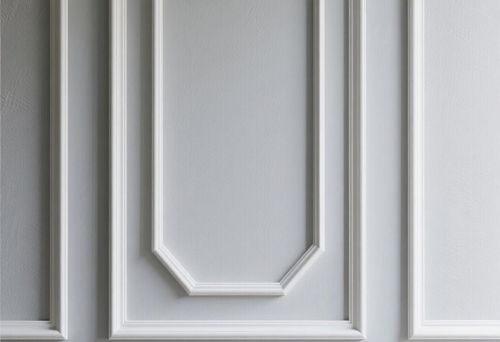 White decorative molding on the wall of a modern interior