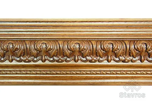 Carved wooden casing with relief ornament, adorned with classical elements