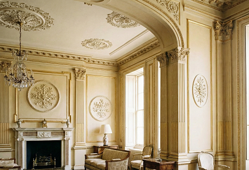 Interior with decorative ceiling rosettes and classical wall pilasters