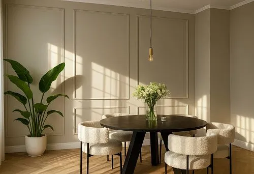 Modern Dining Room with a Round Wooden Table and Soft Armchairs