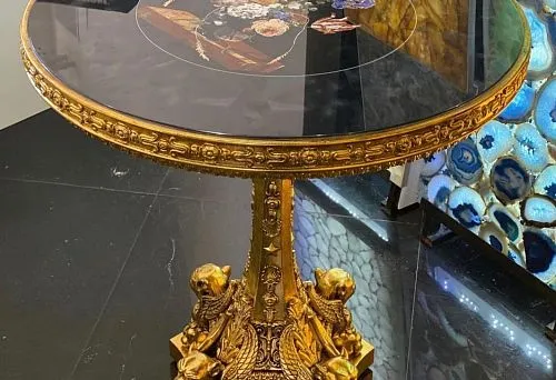 Countertop with artistic inlay on carved golden apron