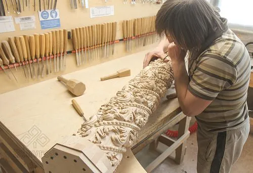 Master Carves Ornament on a Solid Wooden Column by Hand