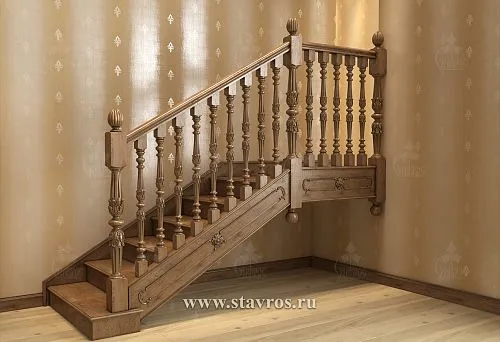 Wooden staircase to the second floor with carved balusters and classic posts