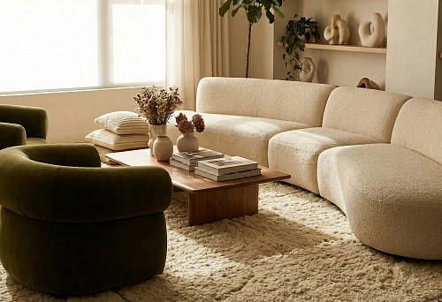 Soft Furniture 2026: Modular Cream Sofa with Rounded Sections and Green Armchairs in a Cozy Living Room