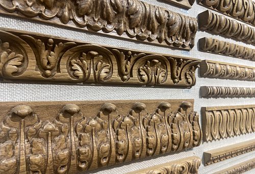 Collection of wooden decorative elements designed for framing and interior decoration