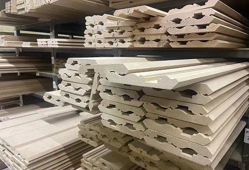 Wooden interior rails on shelf stock, perfectly processed and prepared for wall design.