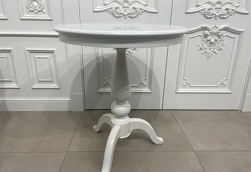 White wooden round side table with carved leg, in classic style